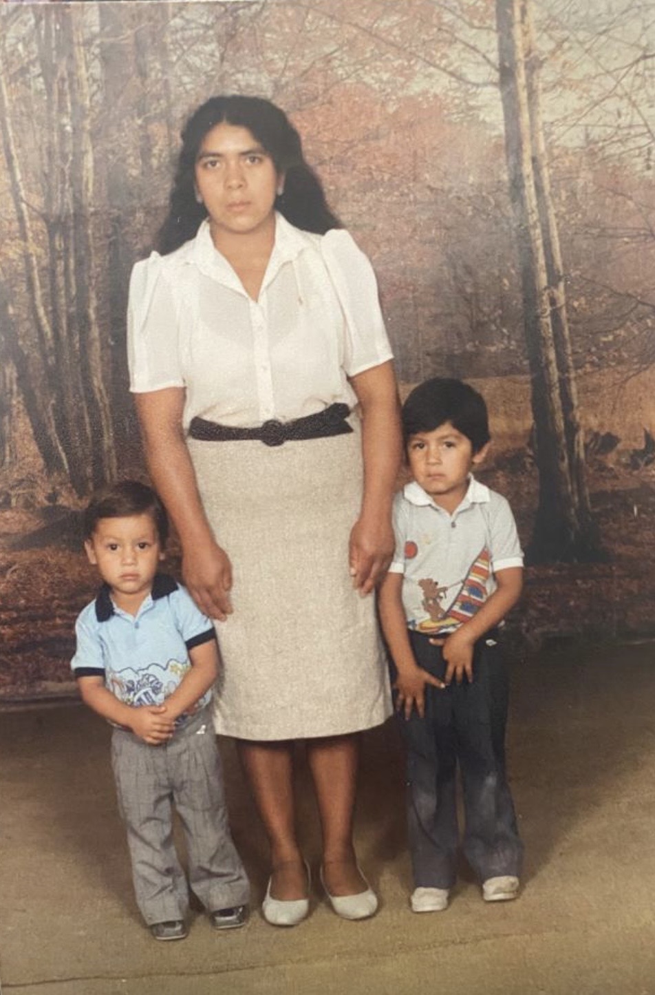 Childhood photo with mother and brother
